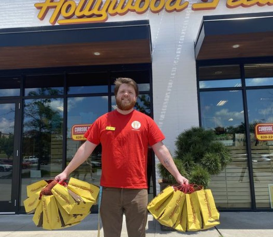 Hollywood Feed Staff with a bunch of HF Yellow Bags